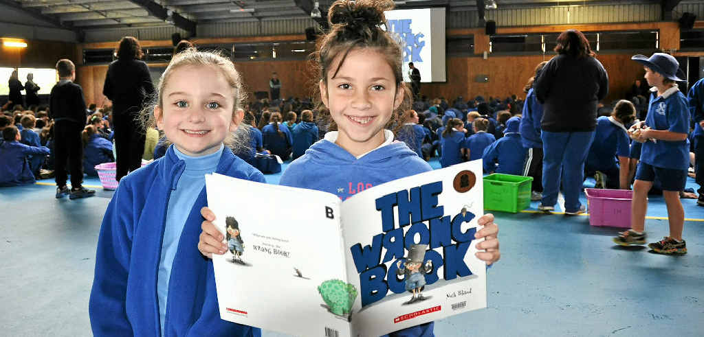 Year 1s Amity Willett and Gracie Forbes get familiar with The Wrong Book at Wednesday's Simultaneous Storytime. Year 1s Amity Willett and Gracie Forbes get familiar with The Wrong Book at Wednesday's Simultaneous Storytime.
